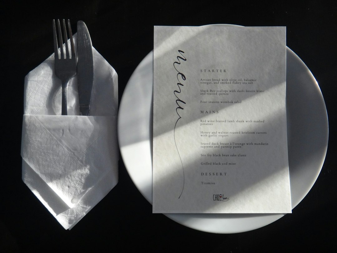 Restaurant table setting with menu and brand materials